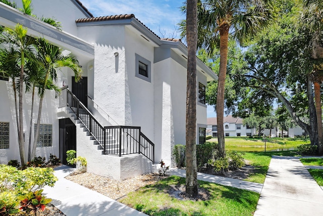 5451 Verona Dr Unit M, Boynton Beach, FL 33437 - view of building exterior with stairway