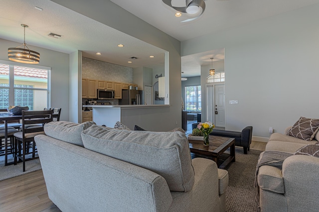 13664 Kiltie Ct, Delray Beach, FL 33446 - living area featuring light wood-type flooring, recessed lighting, baseboards, and ceiling fan