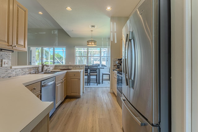 13664 Kiltie Ct, Delray Beach, FL 33446 - kitchen with stainless steel appliances, a sink, light brown cabinets, healthy amount of natural light, and recessed lighting