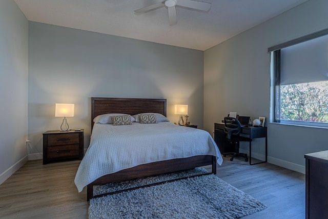 13664 Kiltie Ct, Delray Beach, FL 33446 - bedroom with wood finished floors, baseboards, ceiling fan, and a desk