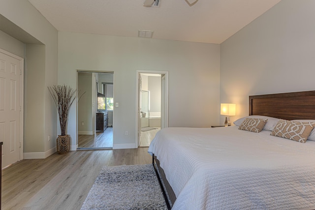 13664 Kiltie Ct, Delray Beach, FL 33446 - bedroom featuring wood finished floors, baseboards, and ensuite bath