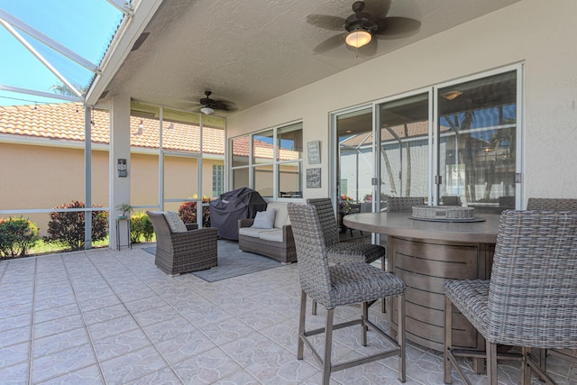 13664 Kiltie Ct, Delray Beach, FL 33446 - view of patio with ceiling fan, grilling area, and glass enclosure