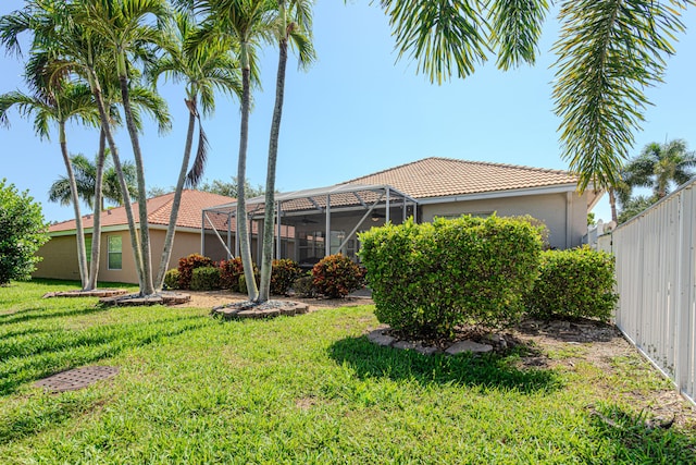 13664 Kiltie Ct, Delray Beach, FL 33446 - back of property with stucco siding, glass enclosure, and a tile roof