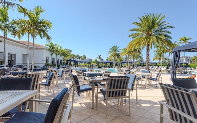 13664 Kiltie Ct, Delray Beach, FL 33446 - view of patio with a community pool