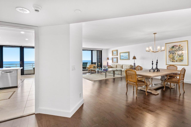 1500 S Ocean Blvd Unit 804, Boca Raton, FL 33432 - dining space featuring a wall of windows, wood finished floors, healthy amount of natural light, and a chandelier