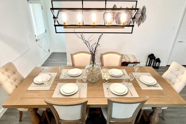 2809 SW 46th St, Dania Beach, FL 33312 - dining area featuring baseboards and wood finished floors