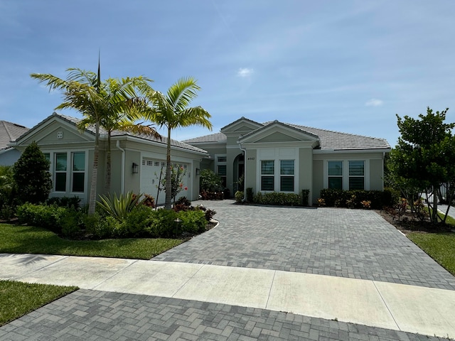4662 Estates Cir, Westlake, FL 33470 - single story home featuring decorative driveway, a garage, and stucco siding