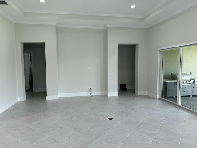 4662 Estates Cir, Westlake, FL 33470 - empty room featuring a tray ceiling, crown molding, recessed lighting, light tile patterned floors, and baseboards