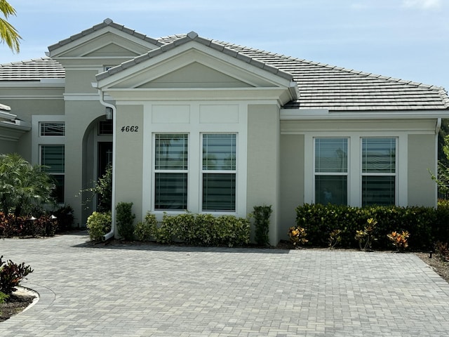 4662 Estates Cir, Westlake, FL 33470 - view of front facade featuring stucco siding and a tile roof