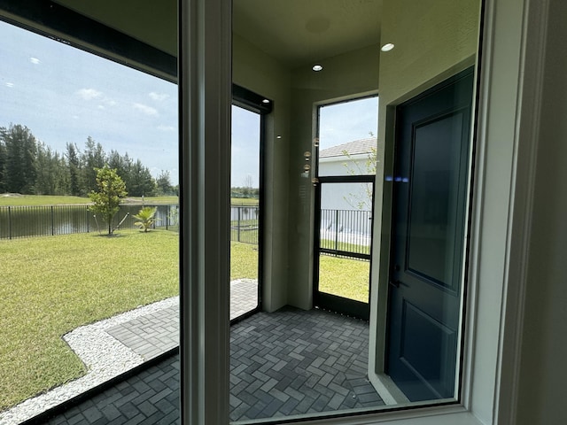 4662 Estates Cir, Westlake, FL 33470 - entryway with a water view and brick patterned floors