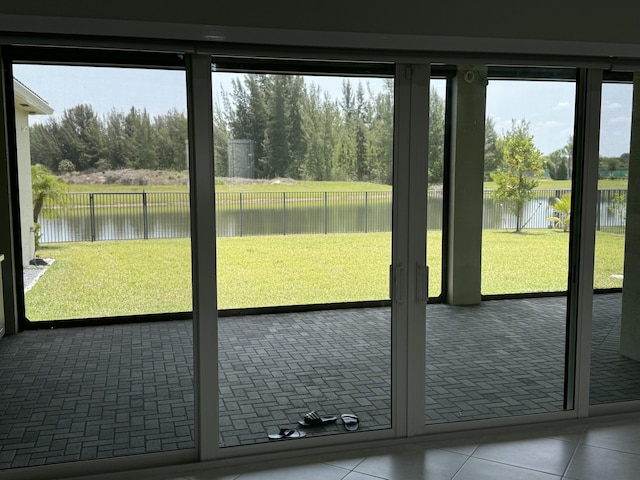 4662 Estates Cir, Westlake, FL 33470 - entryway featuring a water view and tile patterned flooring