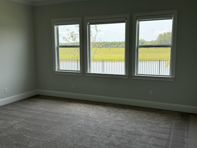 4662 Estates Cir, Westlake, FL 33470 - empty room with carpet, baseboards, a water view, and crown molding