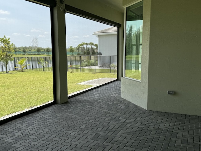 4662 Estates Cir, Westlake, FL 33470 - unfurnished sunroom featuring a water view