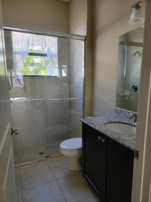 4295 55th St, Vero Beach, FL 32967 - full bath featuring a shower stall, tile patterned flooring, vanity, and toilet