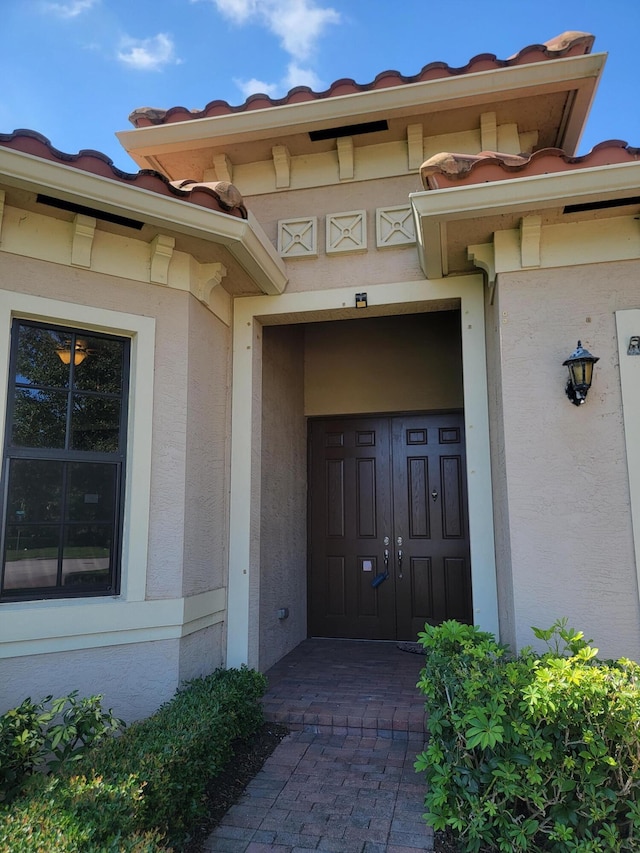 4295 55th St, Vero Beach, FL 32967 - view of exterior entry featuring stucco siding