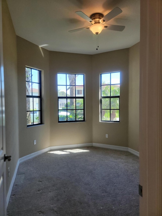 4295 55th St, Vero Beach, FL 32967 - carpeted empty room featuring healthy amount of natural light, a ceiling fan, and baseboards