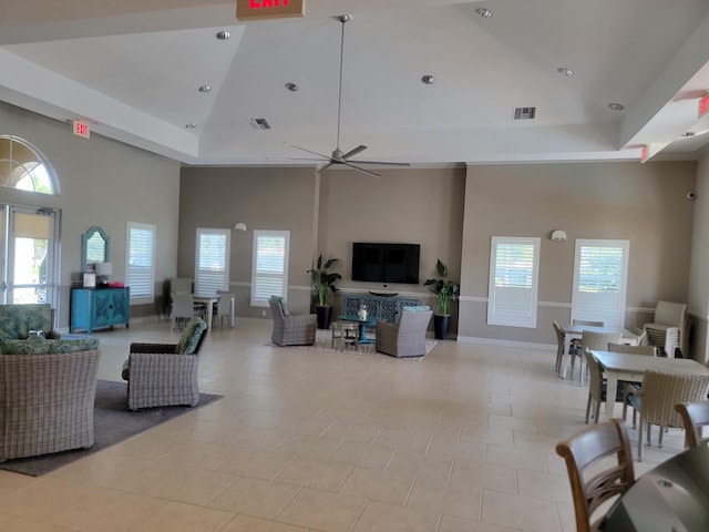 4295 55th St, Vero Beach, FL 32967 - living room featuring high vaulted ceiling, plenty of natural light, ceiling fan, recessed lighting, and baseboards