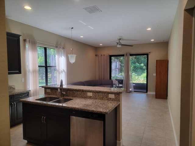 4295 55th St, Vero Beach, FL 32967 - kitchen with stainless steel dishwasher, a sink, open floor plan, healthy amount of natural light, and recessed lighting