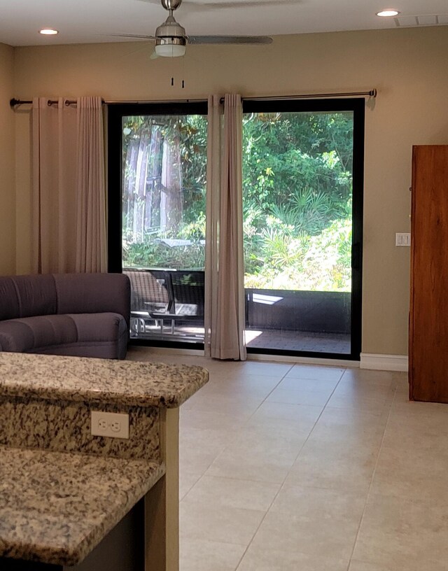 4295 55th St, Vero Beach, FL 32967 - entryway featuring light tile patterned floors, recessed lighting, and baseboards