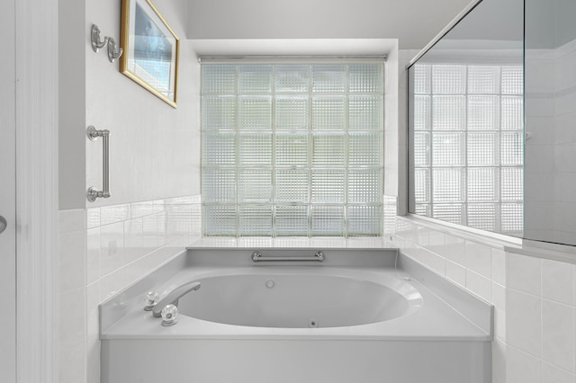 550 SW Sanctuary Dr, Port Saint Lucie, FL 34986 - bathroom with a whirlpool tub