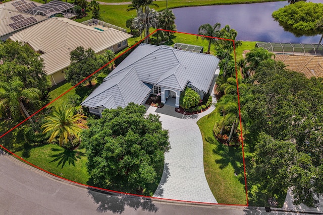 550 SW Sanctuary Dr, Port Saint Lucie, FL 34986 - aerial view of property and surrounding area featuring property boundaries highlighted and a large body of water