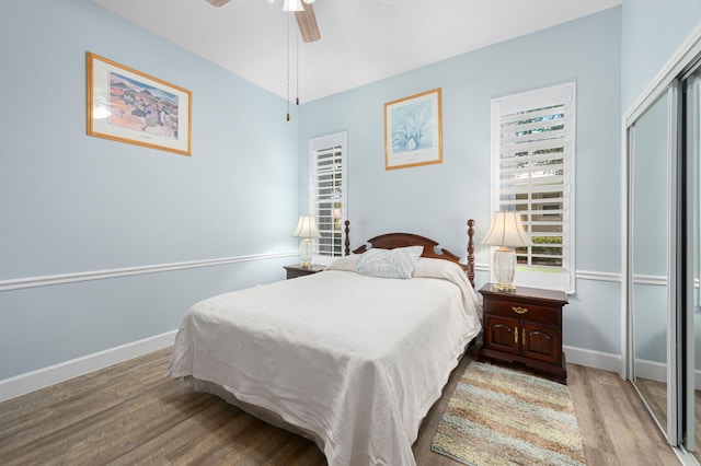 550 SW Sanctuary Dr, Port Saint Lucie, FL 34986 - bedroom featuring light wood-style flooring, baseboards, a closet, and a ceiling fan