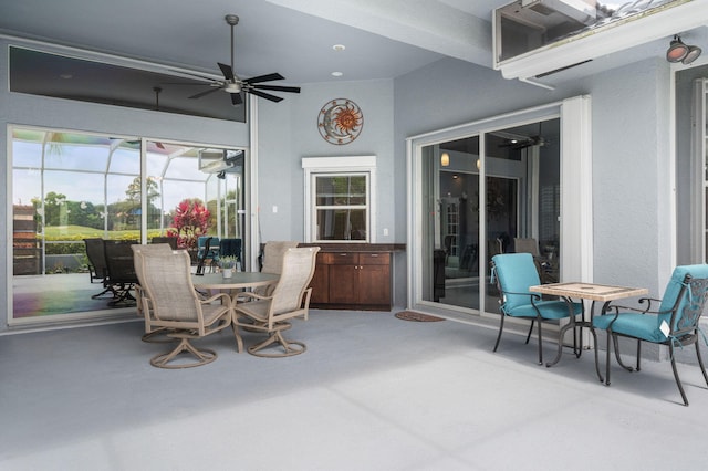 550 SW Sanctuary Dr, Port Saint Lucie, FL 34986 - view of patio with ceiling fan, outdoor dining space, and a lanai