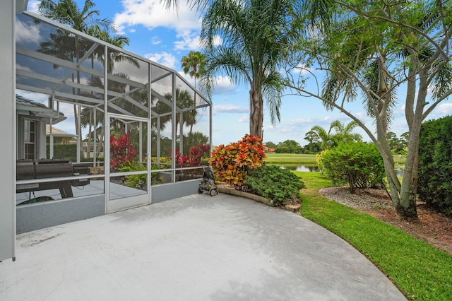 550 SW Sanctuary Dr, Port Saint Lucie, FL 34986 - view of patio / terrace featuring a water view and a lanai