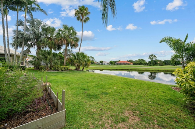 550 SW Sanctuary Dr, Port Saint Lucie, FL 34986 - view of grassy yard featuring a water view