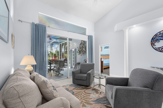 550 SW Sanctuary Dr, Port Saint Lucie, FL 34986 - living room featuring a ceiling fan, high vaulted ceiling, and ornate columns