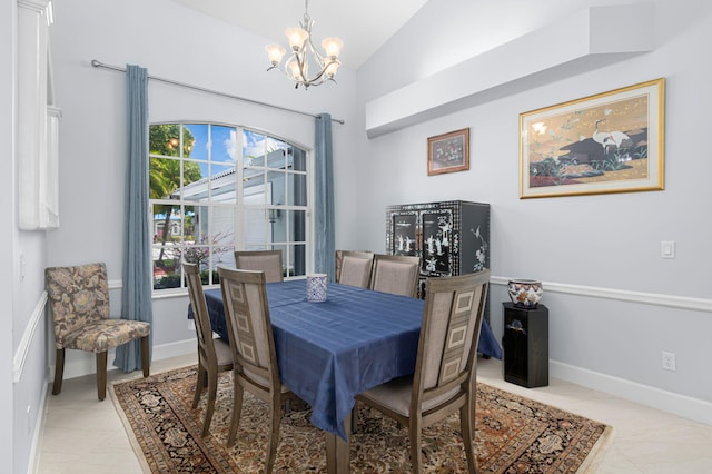 550 SW Sanctuary Dr, Port Saint Lucie, FL 34986 - dining area featuring a chandelier, lofted ceiling, and baseboards