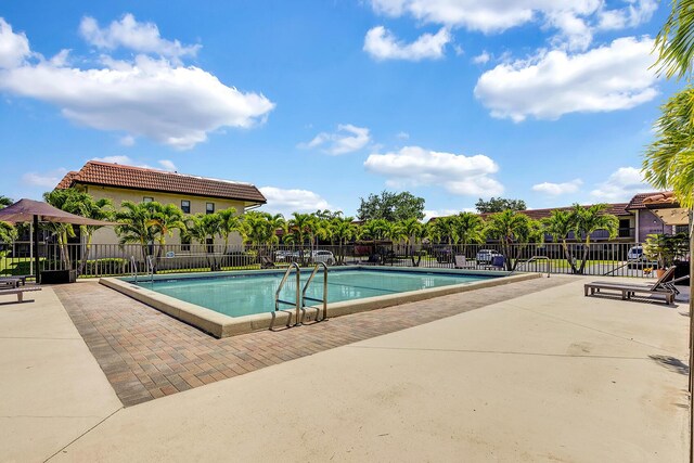 21895 Lake Forest Cir Unit 201, Boca Raton, FL 33433 - community pool featuring a patio area