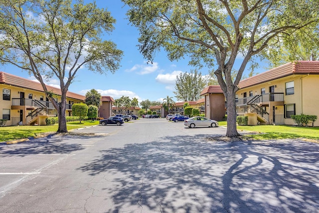 21895 Lake Forest Cir Unit 201, Boca Raton, FL 33433 - view of asphalt street with stairway and a residential view