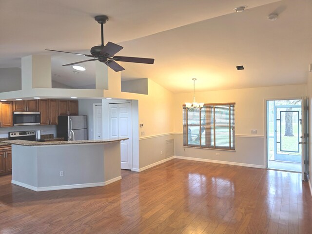 4365 SW Appleseed Rd, Port Saint Lucie, FL 34953 - kitchen with stainless steel appliances, lofted ceiling, a chandelier, ceiling fan, and dark wood-style flooring