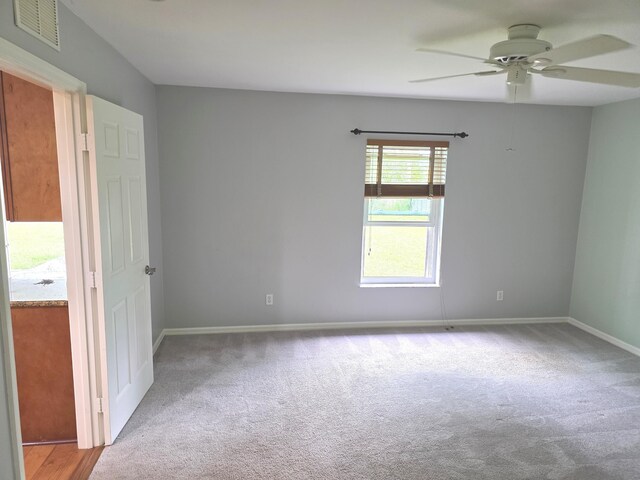 4365 SW Appleseed Rd, Port Saint Lucie, FL 34953 - carpeted spare room with ceiling fan and baseboards
