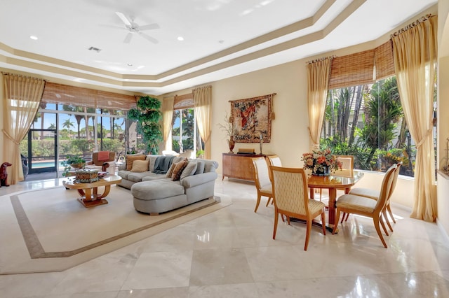 7919 L Aquila Way, Delray Beach, FL 33446 - living area featuring a tray ceiling, ceiling fan, plenty of natural light, light marble finish floors, and recessed lighting