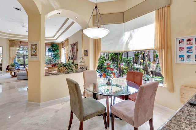 7919 L Aquila Way, Delray Beach, FL 33446 - dining area with ceiling fan, baseboards, and healthy amount of natural light