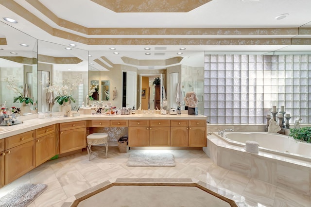 7919 L Aquila Way, Delray Beach, FL 33446 - bathroom featuring a garden tub, double vanity, and a raised ceiling