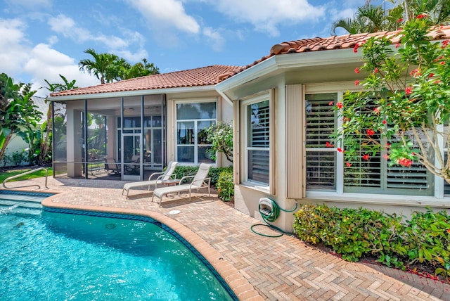 7919 L Aquila Way, Delray Beach, FL 33446 - swimming pool with a sunroom and a patio area