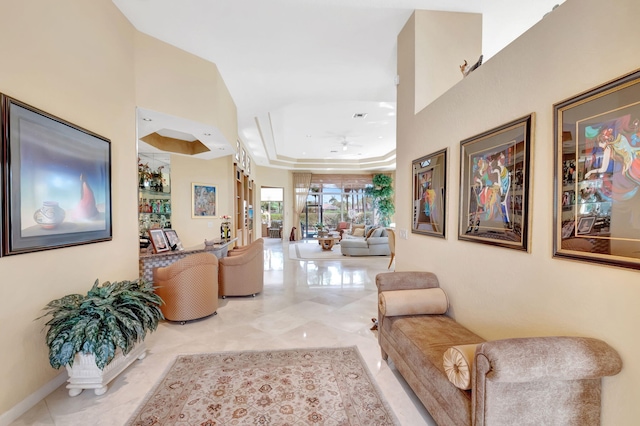 7919 L Aquila Way, Delray Beach, FL 33446 - hall featuring a raised ceiling and tile patterned floors