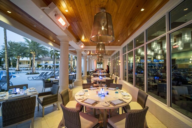 7919 L Aquila Way, Delray Beach, FL 33446 - dining space featuring decorative columns, wood ceiling, a chandelier, and recessed lighting