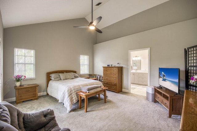 15048 85th Rd N, The Acreage, FL 33470 - bedroom with high vaulted ceiling, light colored carpet, ensuite bathroom, baseboards, and a ceiling fan