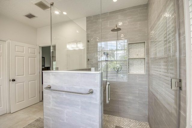 15048 85th Rd N, The Acreage, FL 33470 - bathroom featuring tile patterned floors and a stall shower