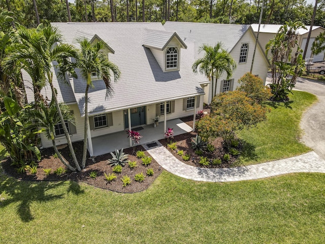 15048 85th Rd N, The Acreage, FL 33470 - view of front of home with covered porch and a front yard