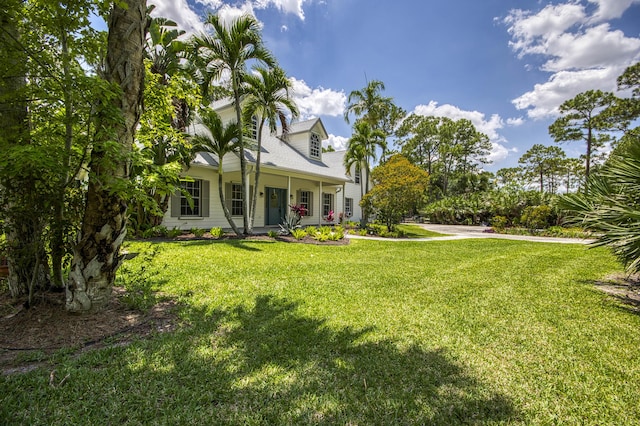 15048 85th Rd N, The Acreage, FL 33470 - view of grassy yard featuring covered porch