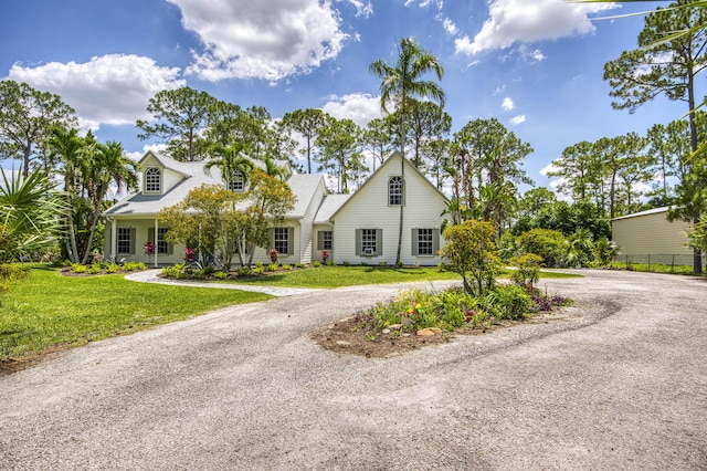 15048 85th Rd N, The Acreage, FL 33470 - view of front of home with curved driveway and a front lawn