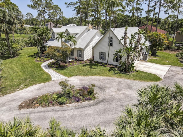 15048 85th Rd N, The Acreage, FL 33470 - view of front of home with driveway, a front lawn, and an attached garage
