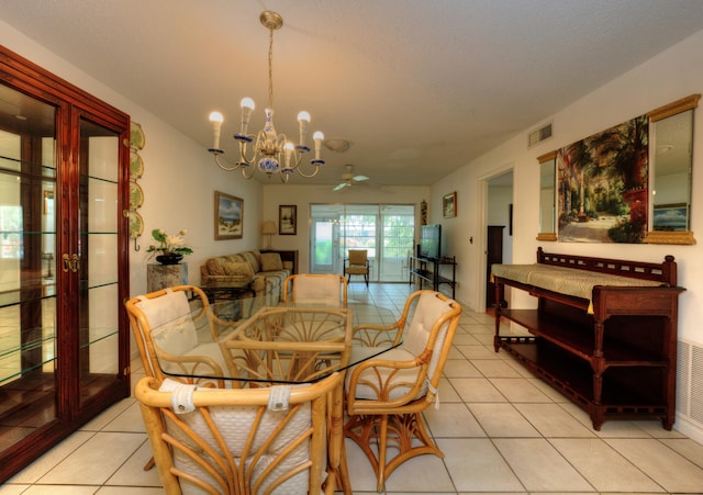 dining room featuring a chandelier, light tile patterned flooring, and ceiling fan