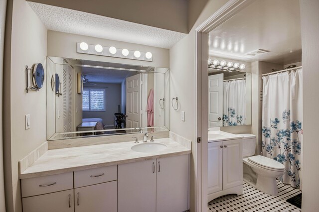 236 Village Blvd Unit 1303, Tequesta, FL 33469 - full bath featuring vanity, toilet, tile patterned flooring, and a shower with curtain
