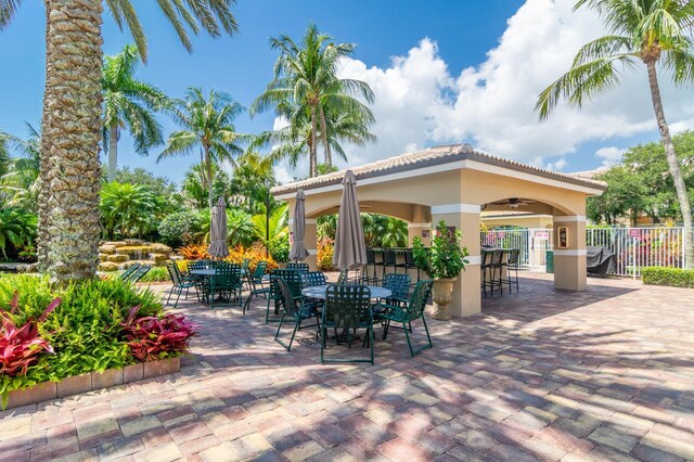 236 Village Blvd Unit 1303, Tequesta, FL 33469 - view of patio featuring a ceiling fan and outdoor dining space
